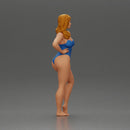 Elegant pose in blue swimsuit showcasing confidence and grace - Only-Games