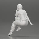 young woman sitting taking off her bib overalls - Only-Games