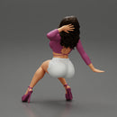 Young sexy girl in shorts with long hair is sitting with one hand in hair - Only-Games