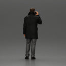 Turkish man in a coat with sweater standing talking on the mobile phone - Only-Games