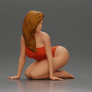 Beautiful Woman in One-Piece Bikini in a Kneeling Pin-Up Pose on the Beach - Only-Games