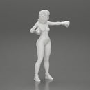 black naked breasts woman in boxing gloves with curly hair ready to finish off her opponent - Only-Games