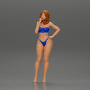 sexy girl in bikini standing smoking cigarette on the beach - Only-Games