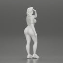 young woman in shorts and headphones shields her eyes from the sunlight - Only-Games