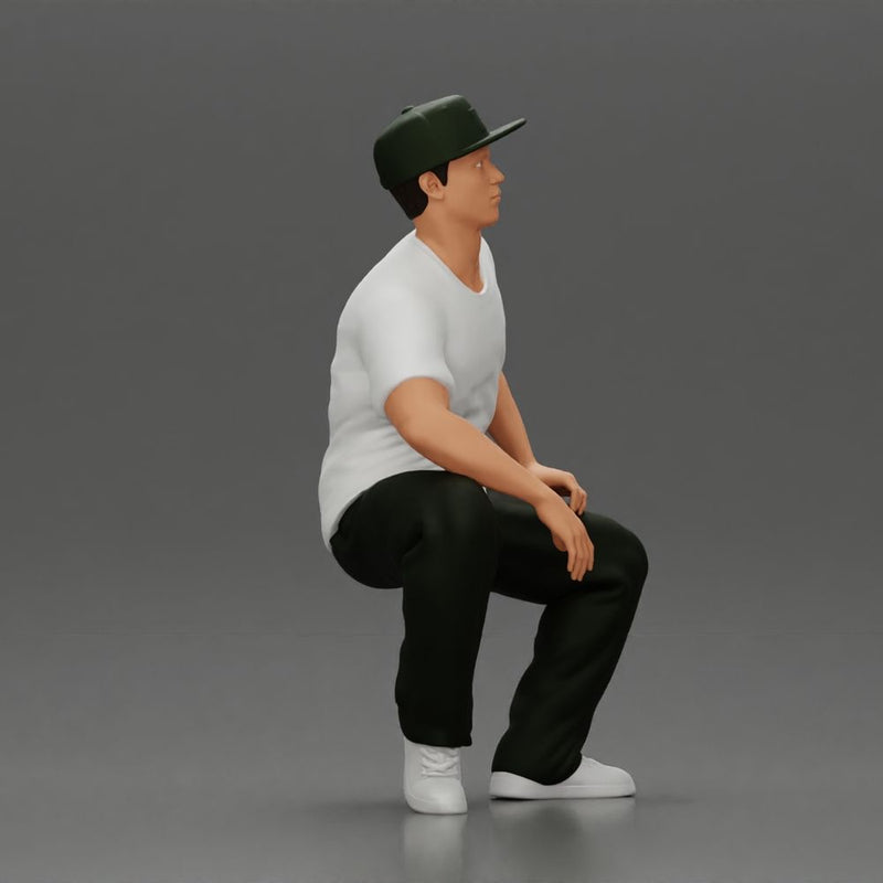 hip-hop man sitting in shirt and cap