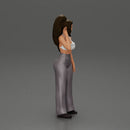 Stylish woman in a crop top and pants, standing thoughtfully - Only-Games