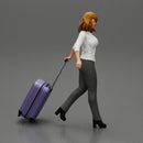 2 Business woman in shirt and trousers pulling suitcase walking in airport terminal - Only-Games