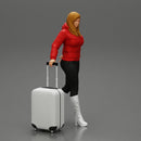 2 Fashion woman in jacket and boots dragging suitcase  walking in airport terminal - Only-Games