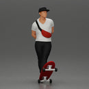 skater man leaning against the wall wearing a cap and banana bag - Only-Games