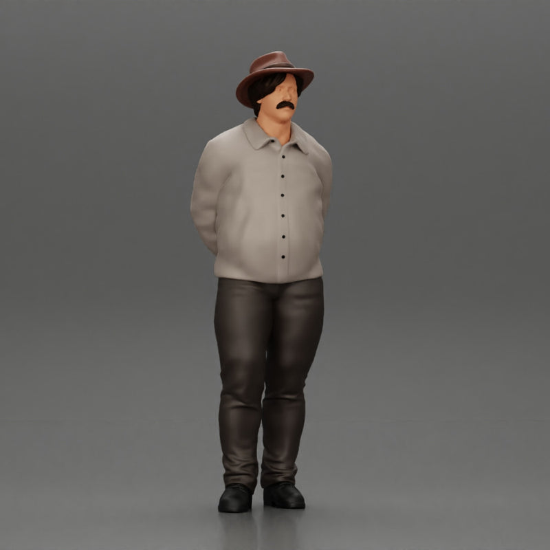 Man in a hat putting hands behind his back ( pablo escobar )