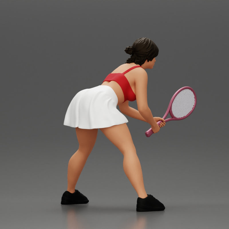 sexy tennis player in skirt holding her racket in a ready position