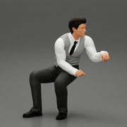 young businessman sitting and holding briefcase of money - Only-Games