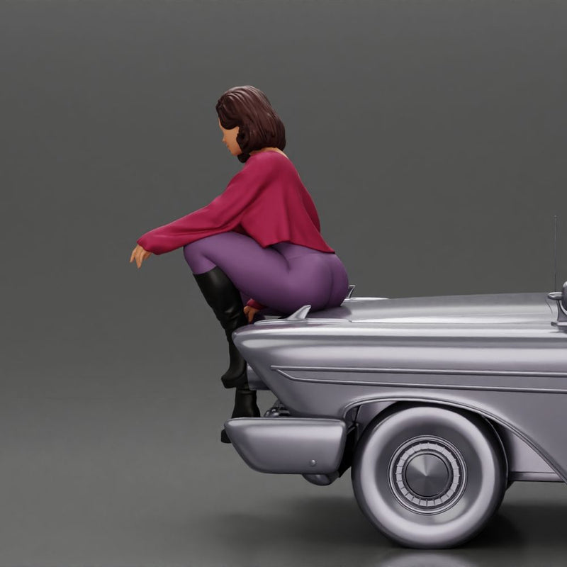 lowrider girl sitting on a car, wearing boots and a stylish shirt