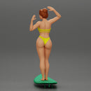 young girl posing and riding on the surfboard at the beach - Only-Games