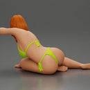 attractive girl in a bikini, lying and reclining gracefully on the beach - Only-Games