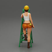 Young girl in helmet mechanic climbing the ladder - Only-Games