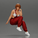 young woman sitting taking off her bib overalls - Only-Games