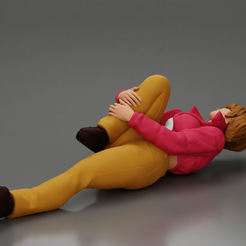 woman in mini jacket  lying on the floor touching her injured knee