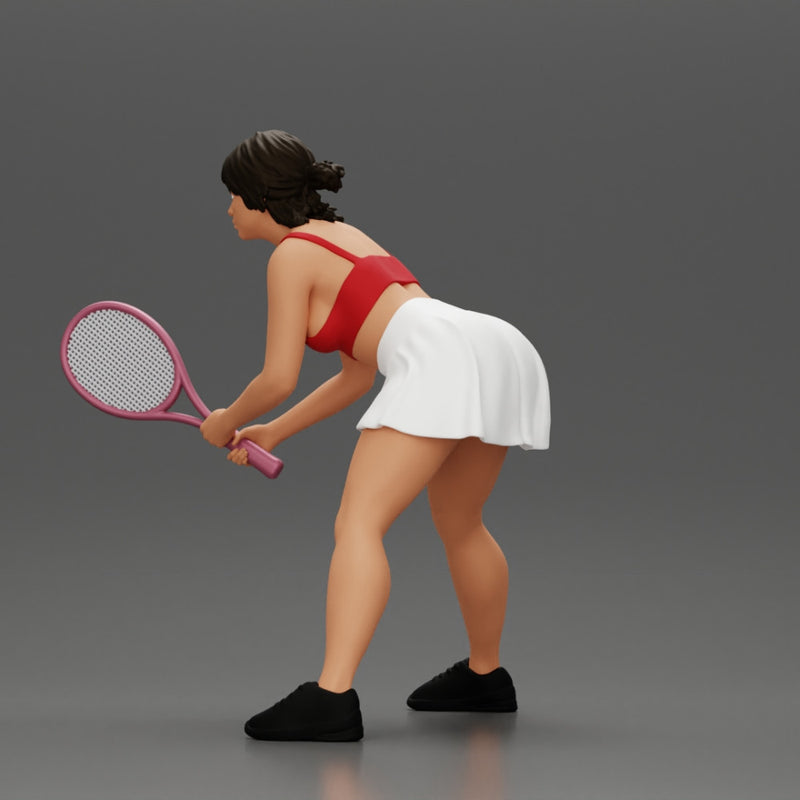 sexy tennis player in skirt holding her racket in a ready position