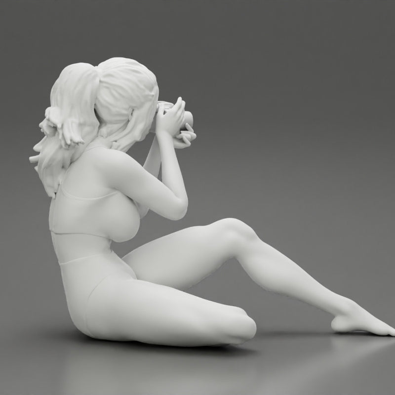 Woman photographer in bikini sitting and holding a camera - Only-Games