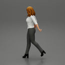 2 Business woman in shirt and trousers pulling suitcase walking in airport terminal - Only-Games