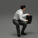 young businessman sitting and holding briefcase of money - Only-Games