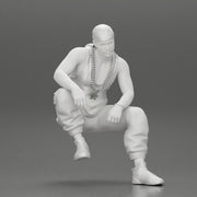 gangster homie in a gold chain and durag is sitting and thinking - Only-Games