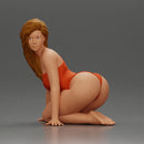 Beautiful Woman in One-Piece Bikini in a Kneeling Pin-Up Pose on the Beach - Only-Games
