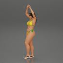 beautiful woman in a bikini with sunglasses standing with her arms raised up on the beach - Only-Games