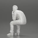 metal man sitting and contemplating with a satanic haircut - Only-Games