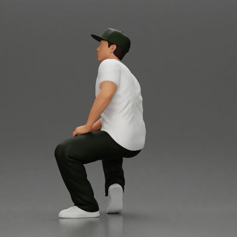 hip-hop man sitting in shirt and cap