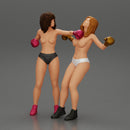 2 separated naked Girls Boxing in boxing gloves ready to finish off in the boxing ring about to be knocked out - Only-Games
