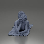 Relaxing on a beach towel, a woman enjoys sunbathing, wrapped in a pareo beach cover and bikini - Only-Games