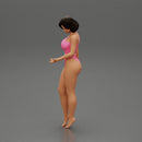 Beautiful girl in onepiece bikini standing on the beach - Only-Games