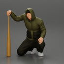 gangster homie in hoodie sitting holding a baseball bat - Only-Games