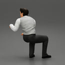 young businessman sitting and holding briefcase of money - Only-Games