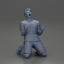 tennis player holding racket sits in celebration of his victory - Only-Games