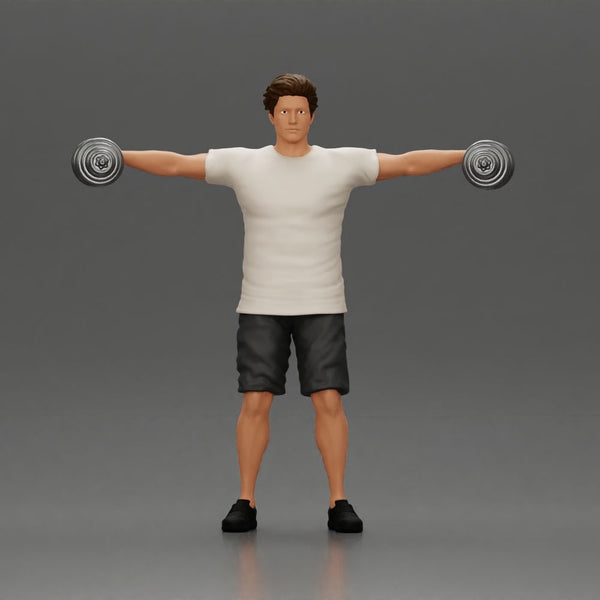 Man in the gym performing shoulder exercises with weights