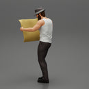 Young Man in hat with beard Holding Map And Looking At it - Only-Games