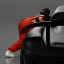 Girl mechanic in overalls turns off the front wheel of  car with a key for removing the wheel - Only-Games