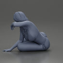 attractive girl in a bikini, lying and reclining gracefully on the beach - Only-Games