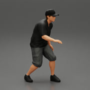 Man bent over while walking in cap - Only-Games