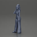 Stylish woman in a crop top and pants, standing thoughtfully - Only-Games