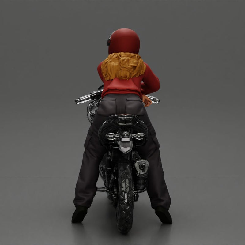 motorcyclist woman in helmet and hoodie sitting on motorcycle