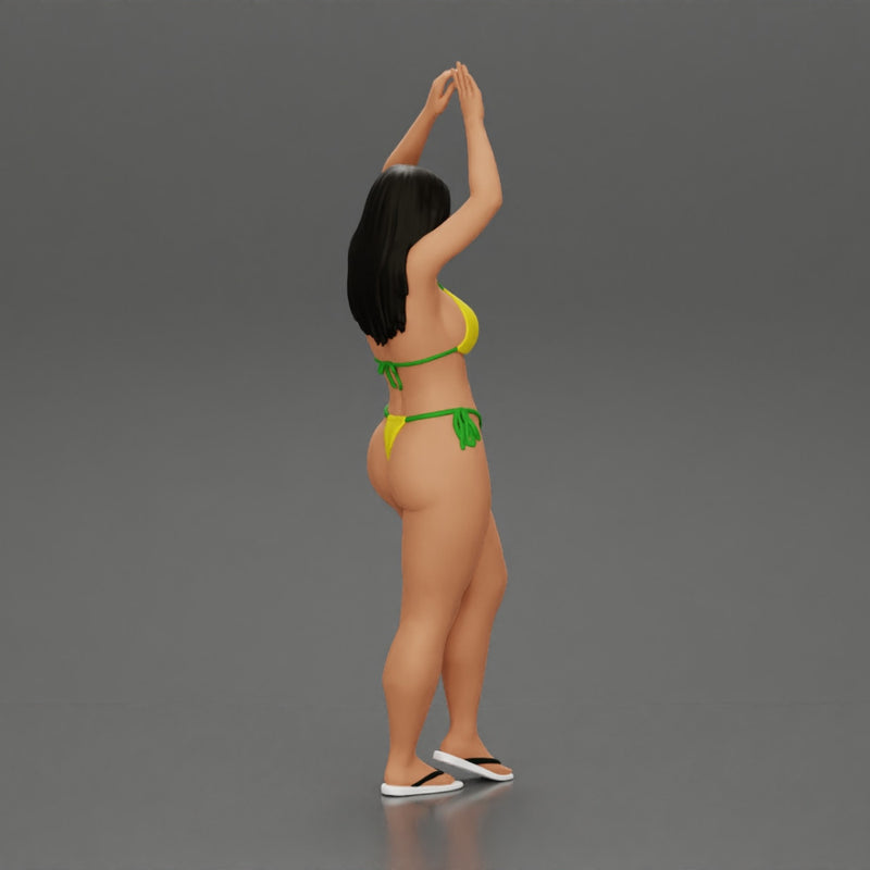 beautiful woman in a bikini with sunglasses standing with her arms raised up on the beach - Only-Games