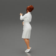 woman in a white bathrobe standing - Only-Games