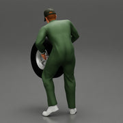 Auto mechanic walking and carrying tyre - Only-Games