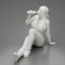 Tired woman mechanic in shirt pants and backwards cap sitting and drinking water during from bottle - Only-Games