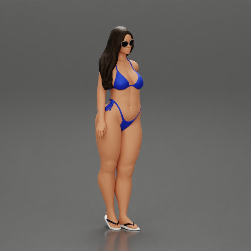 sexy girl in a bikini and sandals with sunglasses  standing putting her left hand on her hip