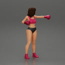 black woman in boxing gloves with curly hair ready to finish off her opponent - Only-Games